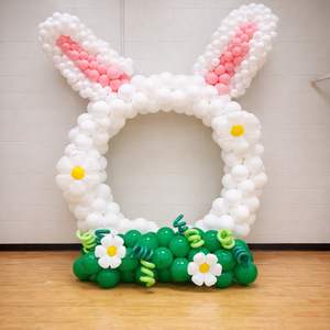 Large Easter bunny balloon sculpture in pastel pink and white for Easter balloon decor in Calgary.