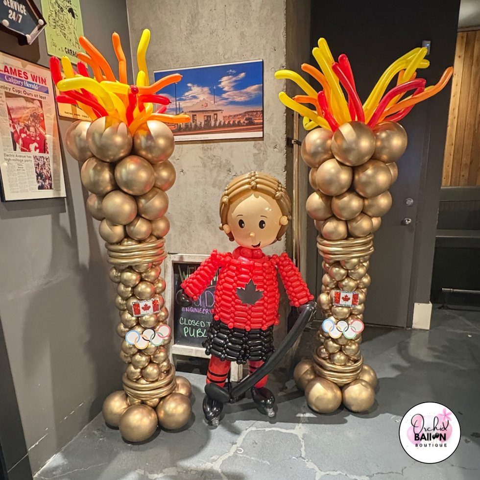 Hockey player balloon sculpture created for sports themed party decor in Calgary.


