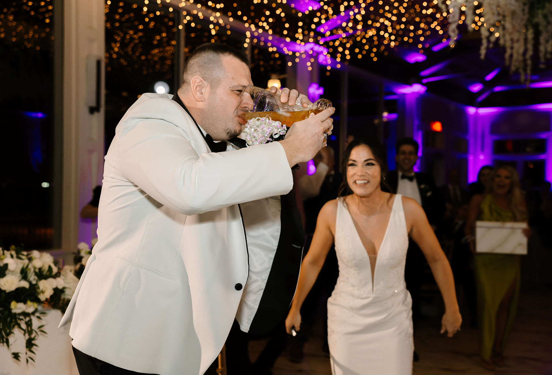 Groom drinking in his Reception Wedding 