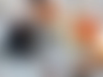 A selection of aromatics and spices arranged around a small cup of herbal tea