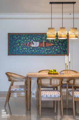 Modern dining room with wooden rattan chairs, a large horizontal boat painting, and elegant hanging pendant lights from a client review.
