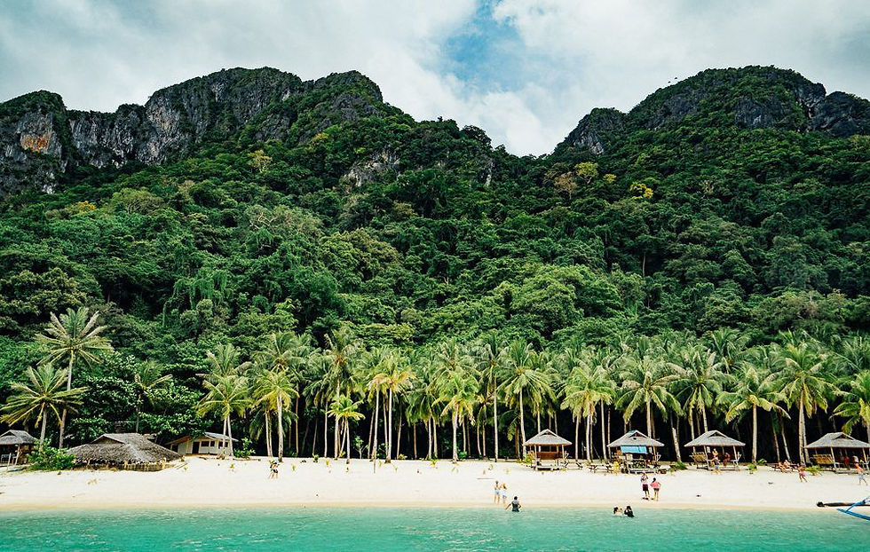 Seven Commandos Beach, El Nido — a long palm-fringed shoreline explored privately on a CILYC Lagoon Escape