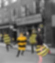 monks dressed as bees outside the St David's bee emporium