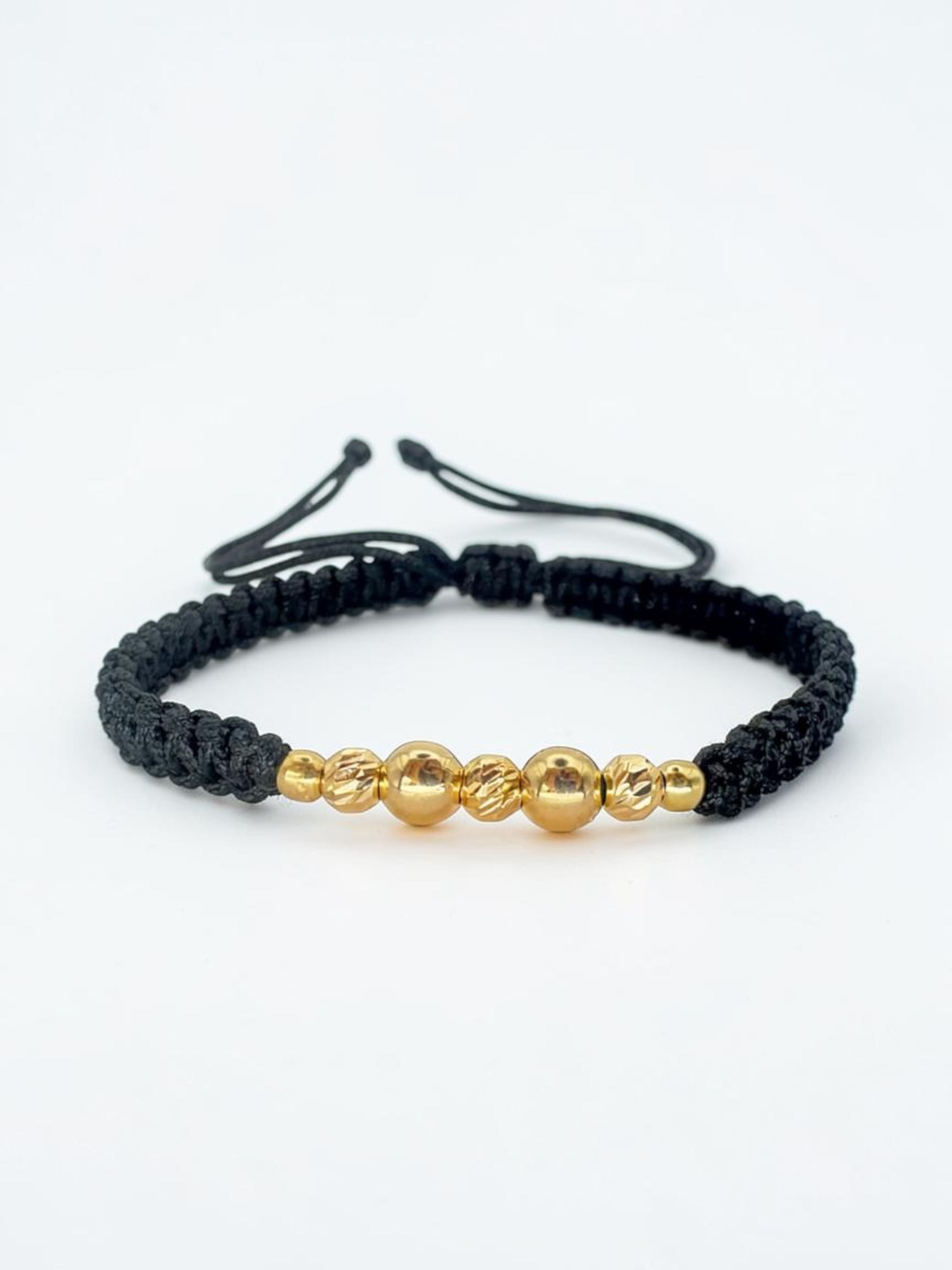 PULSERA EN HILO NEGRO CON BOLAS LISAS / DIAMANTADAS / ORO AMARILLO 18K