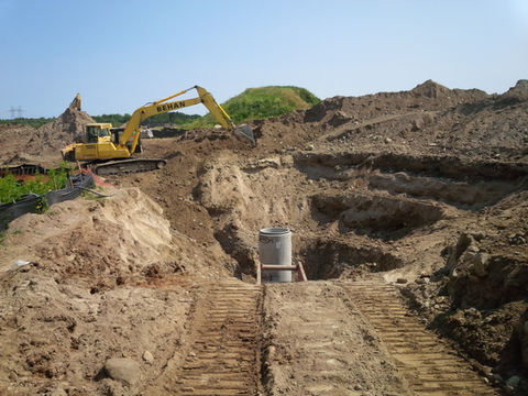 Excavator digging at subdivision development site