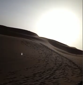 the sun setting in the desert