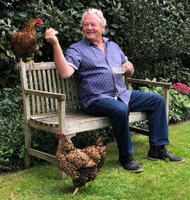 Animal psychologist Mark Vette on a visit to Lush Places. He didn't seem to think the chickens were evil at all.
