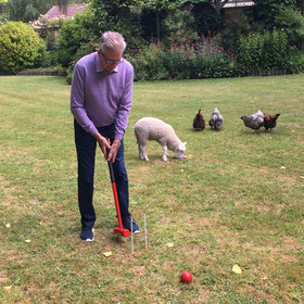 Greg's father, Ron, playing for the win, despite the pitch invasion.