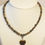 Miniature : Collier en Œil de tigre/pierre de lave cœur