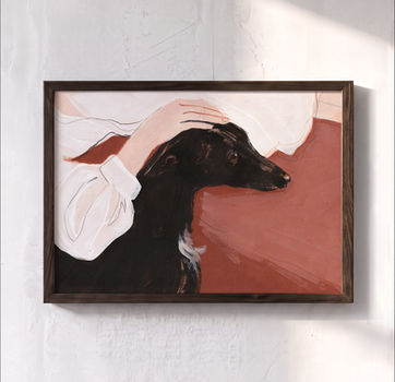 At Her Side, an original modern painting of a black whippet resting beside its owner, displayed in a dark wooden frame by artist Carla Tracy