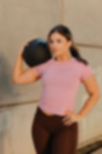 Woman exercising with medicine ball for wellness fitness