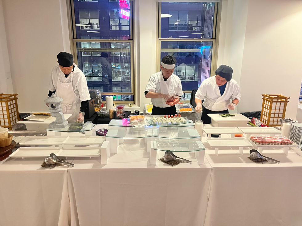 Chefs preparing for SKO sushi catering at private event in New York
