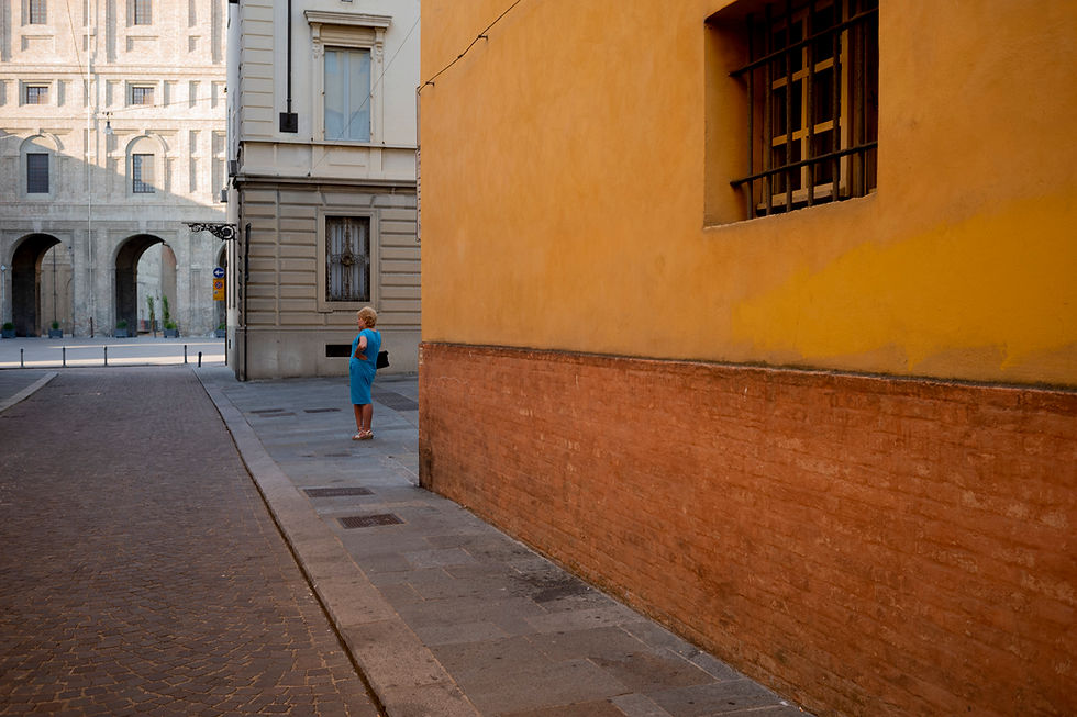 Thumbnail: Woman in blue dress on a street corner, NOKTON 40mm F1.2
