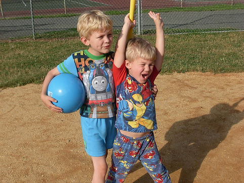 two little boys playing baseball