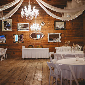 The Tumbleweed Room is easy to decorate! It already has mirrors, tables, chairs, table cloths, lighted drapery, cake table, cake stands and so much more!