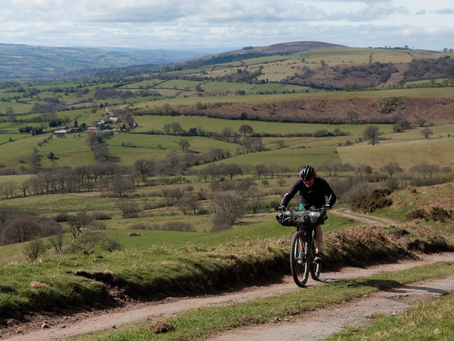 Man on Mountain Bike pedalling uphill
