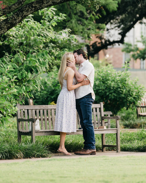 Couple kissing after proposal in Highland Park, Dallas.