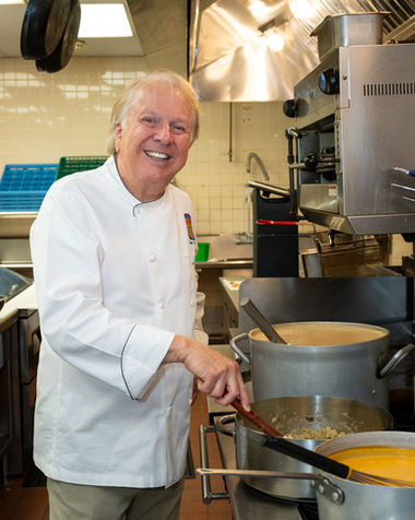 Chef Dean Fearing prepares food for guests at the Neiman Marcus Bejeweled event in Dallas Texas photographed by Jacque Manaugh