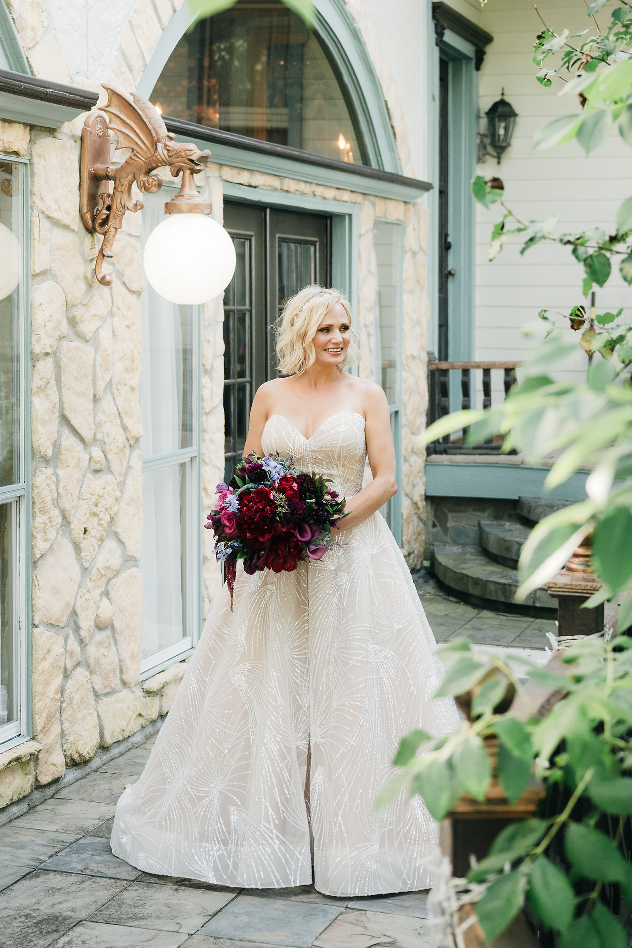 Bride portrait at entrance Braun Manor historic wedding estate Texas.