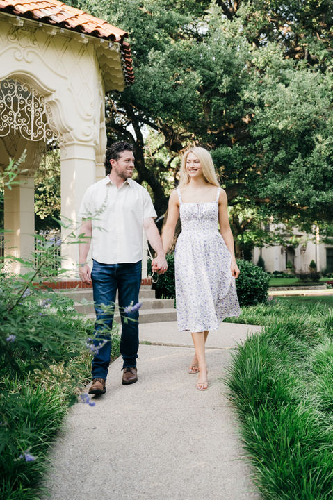 Couple walking by garden architecture in Highland Park.