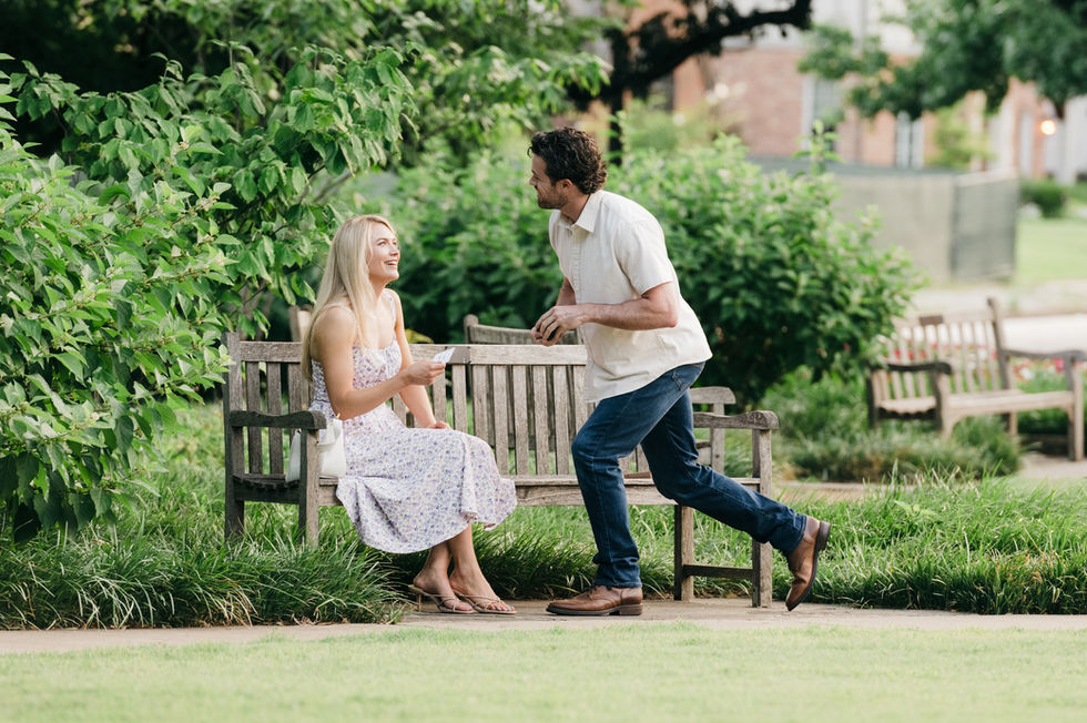 Man preparing to propose in Highland Park garden.