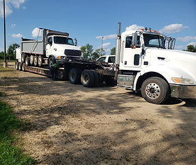 quint dump truck low boy