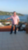 Image of steve relaxing with skiathos harbour in the background