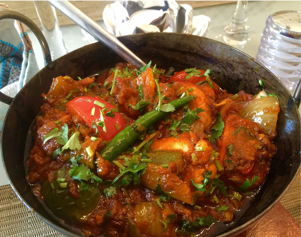 "Chicken Dopiaza served with rice and chapati"