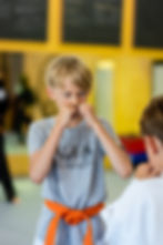 Kid focused hands up.jpg