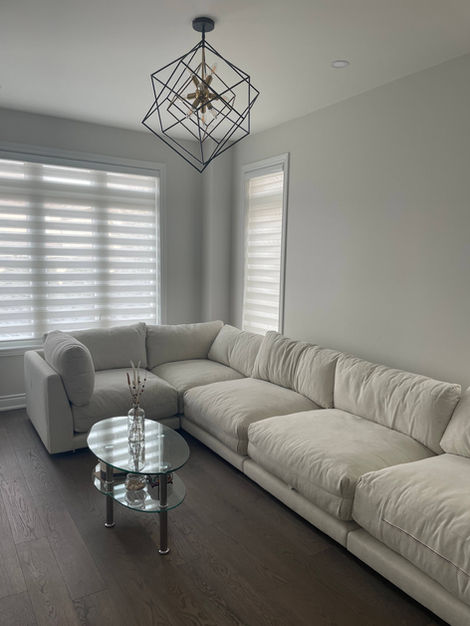 Thornhill Woods interior restoration by StrongRise Builders featuring a precision-leveled open-concept living zone with structural subfloor reinforcement for high-capacity seating and seamless architectural wall finishing.