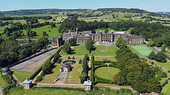 Aerial drone view of a stately home and grounds
