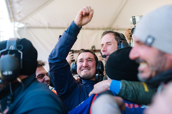 a motorsport team celebrating