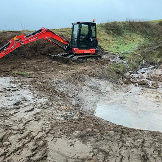 The NW Groundwork digger working in very muddy conditions