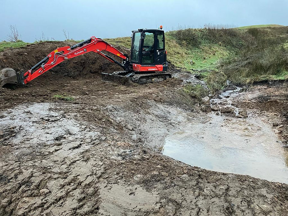 The NW Groundwork digger working in very muddy conditions