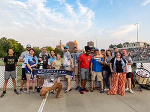 Group photo of Rubber City Underground at a game!