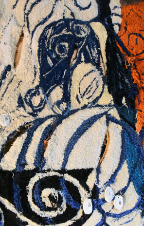 Tamessa Capall Mara Wall Hanging by Ryka Design close head detail showing upper figurative horse head in navy and cream hand-tufted wool with swirling mane lines, bold eye detail, spiral motifs and small shell embellishments