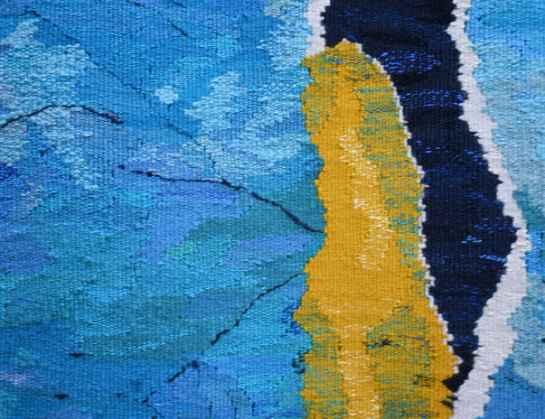 Summer Dive Tapestry by Ryka Design close detail showing amber gold column alongside deep navy band with white outline against layered teal and blue woven wool background