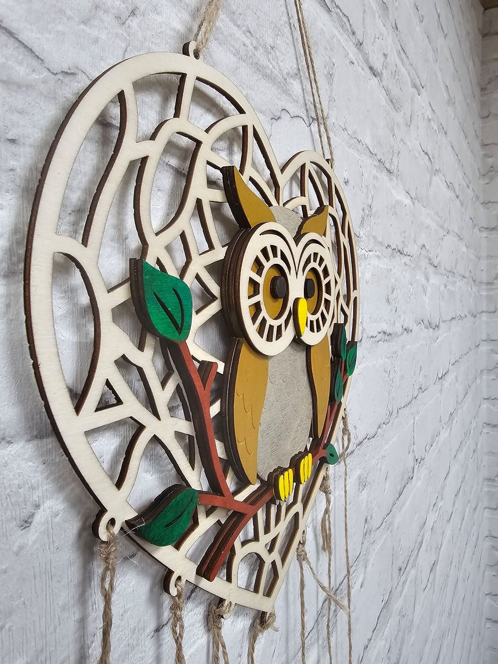 Laser-cut owl dreamcatcher with hanging leaves
