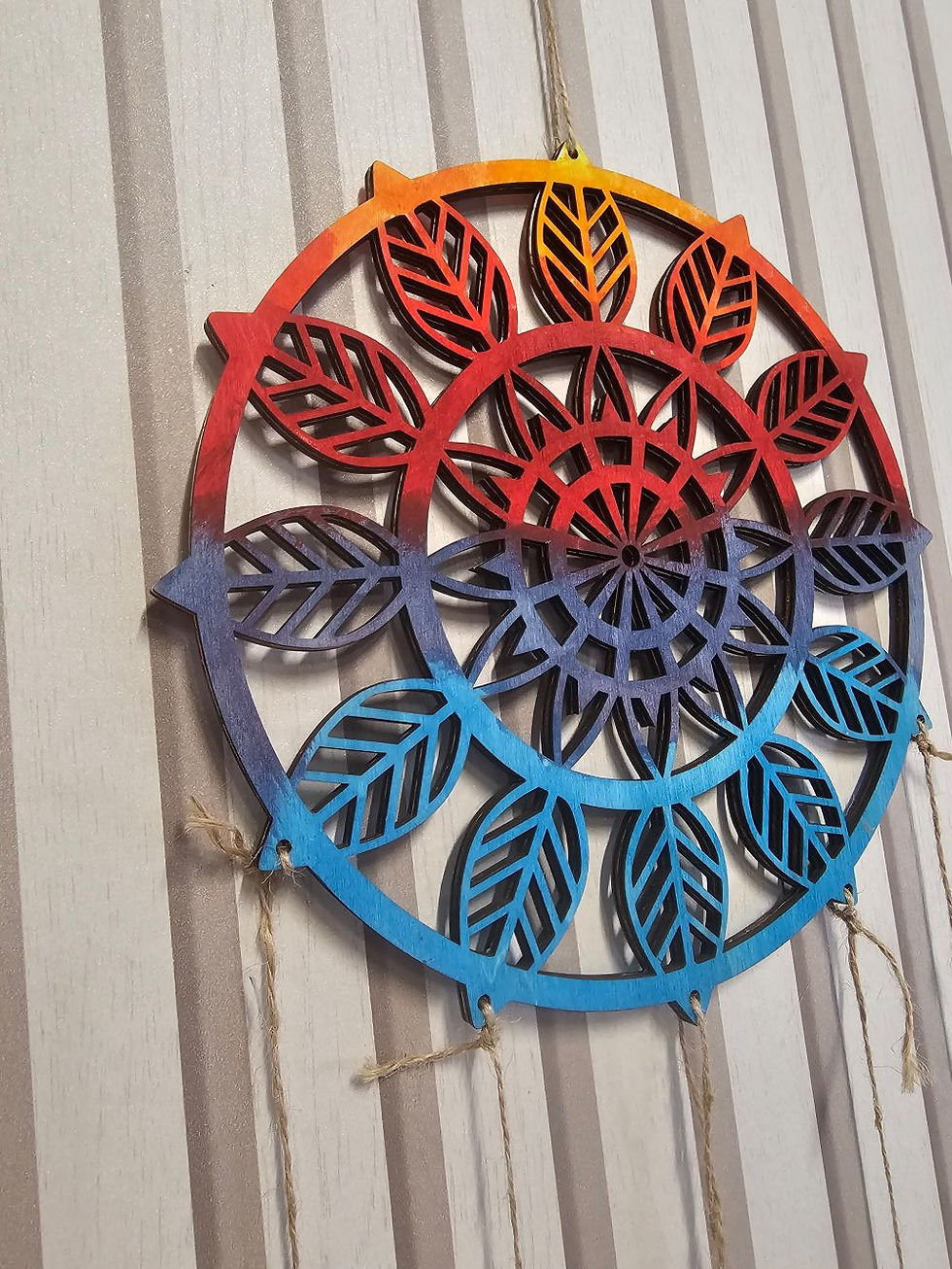 Colorful mandala dreamcatcher with feathers and moon charms