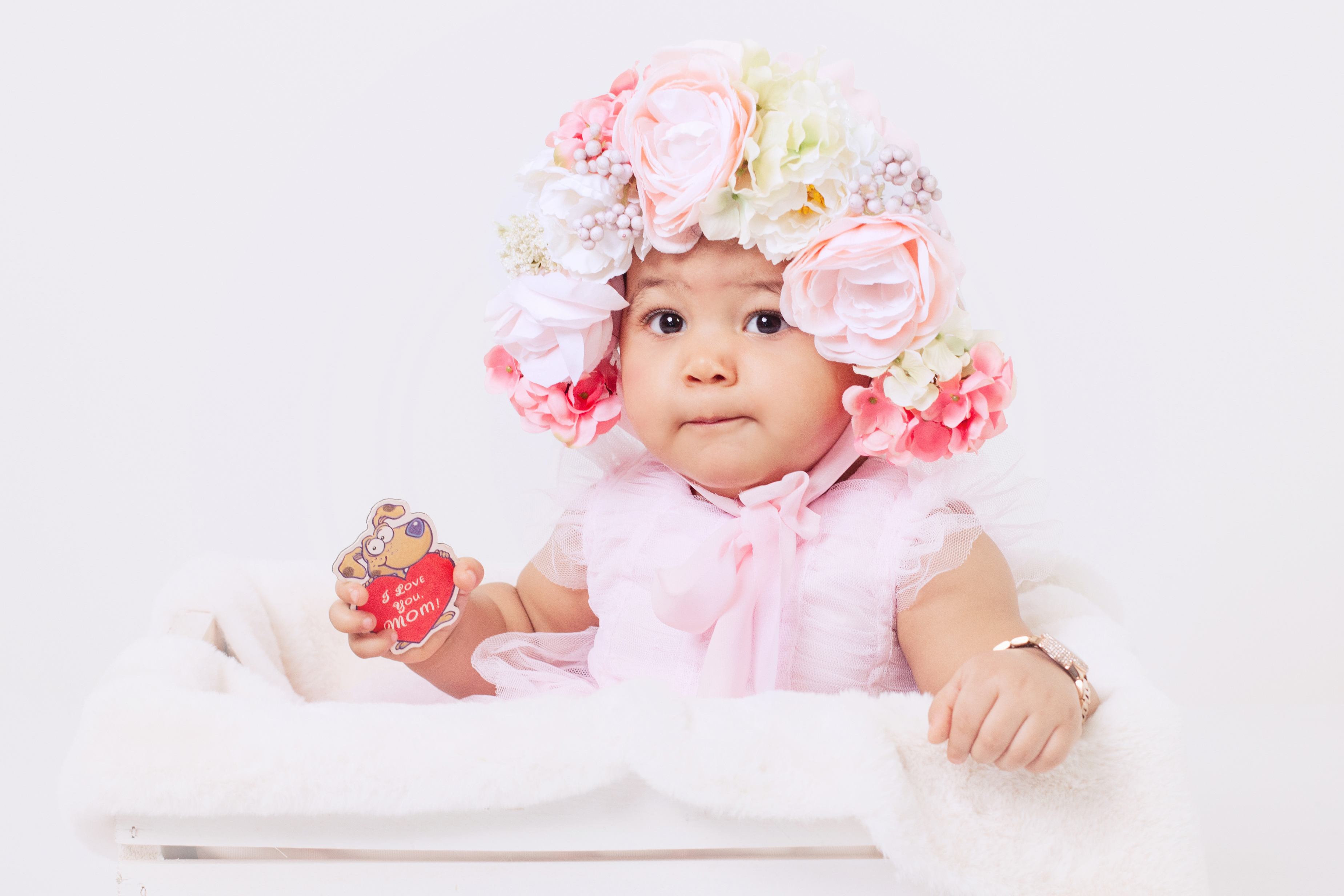 baby in floral bonnet