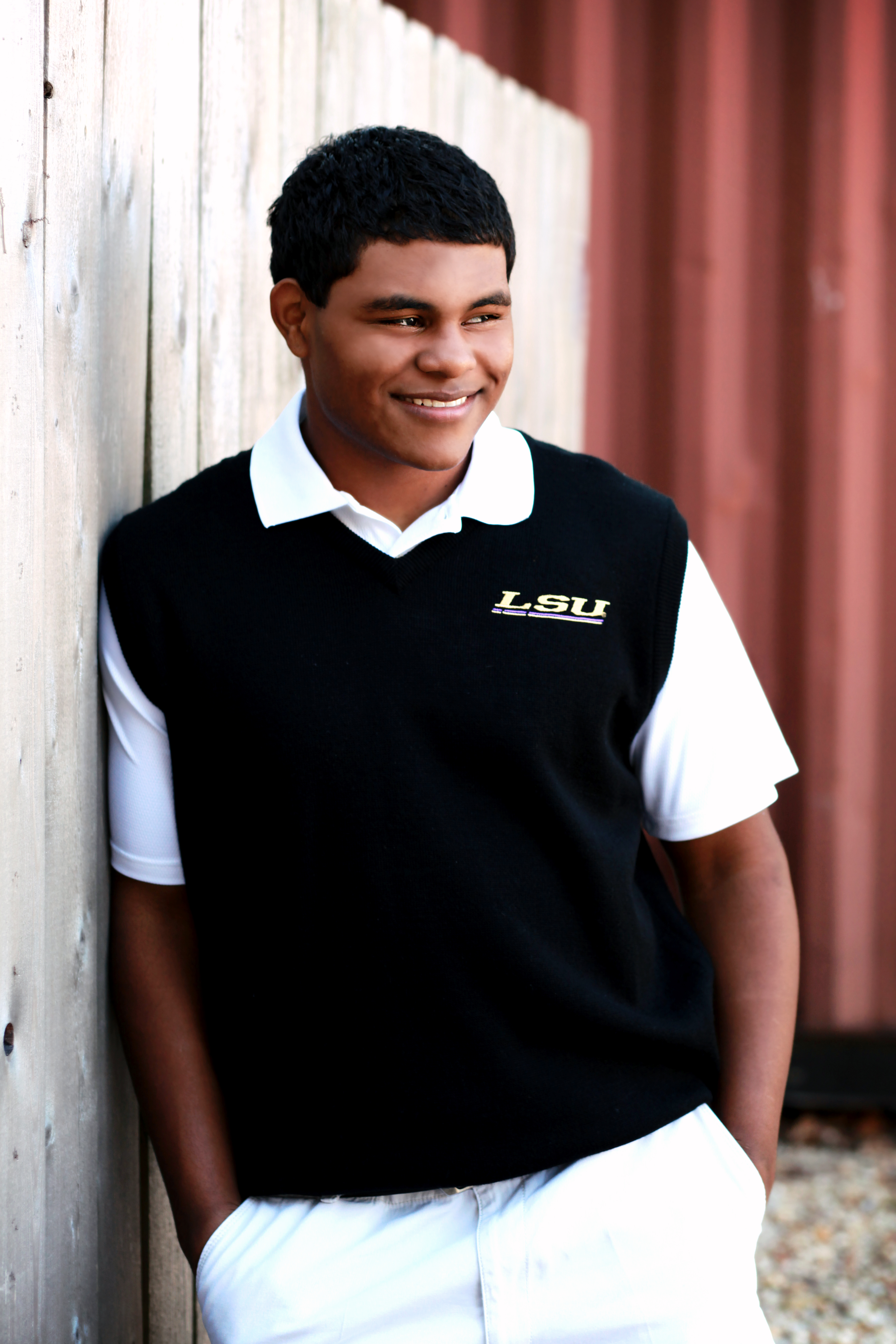 senior boy in vest