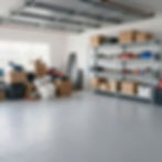 Organized garage with metal shelves and cardboard boxes.