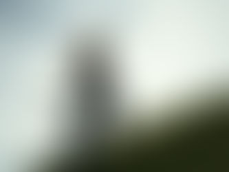 Woman walking up a grassy hill to her freedom and clarity