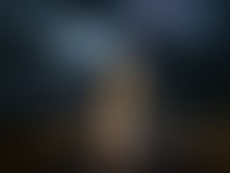 A lone human silhouette dissolving into strands of glowing DNA light, half fragmented, half reforming.