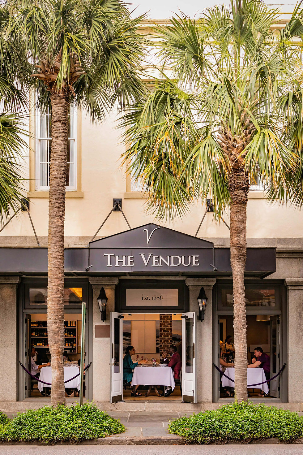 REV-Exterior-DiningWithOpenDoors-V-Web-scaled.jpg