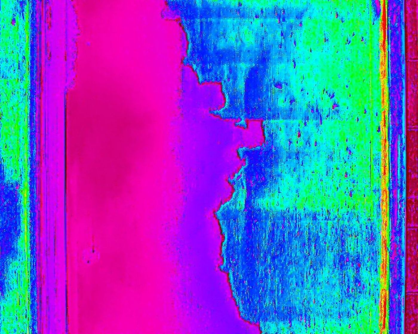 Thermal drone image of the same channel with standing water as a sharp cool area