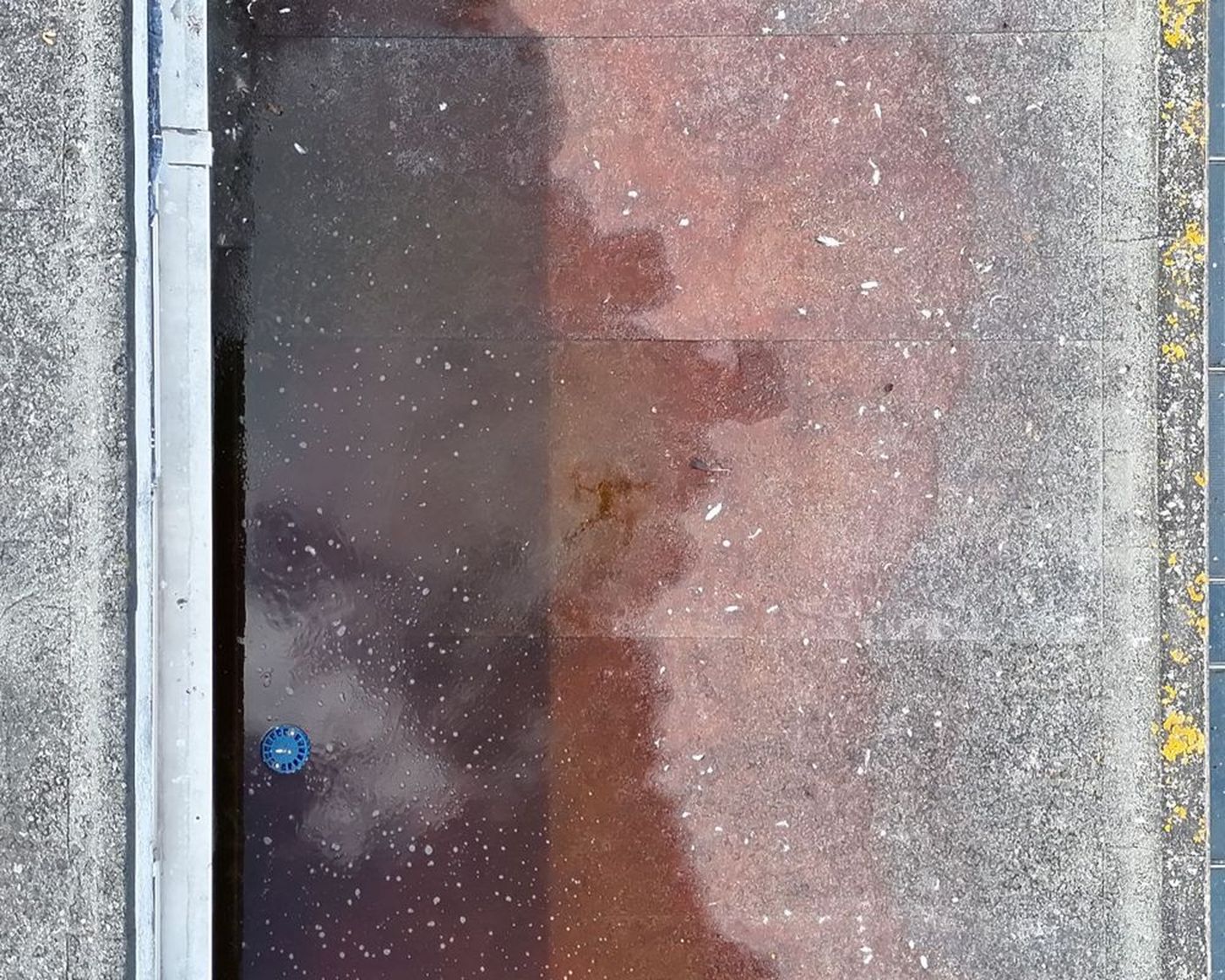 Visual drone image of standing water in a shaded roof channel