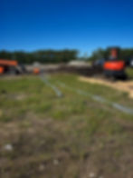 Underground construction company team installing utility pipes