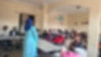 Adama's mother speaks to the Open Dreams Family in Yaoundé at a farewell ceremony