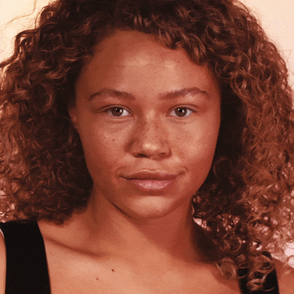 A repeating GIF of a model applying makeup and skincare to their skin to make them glow. Text on the GIF says: 'sweep pearl pigments' and 'get that glow'.
